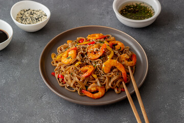 Noodles with shrimps, pepper and soy sauce. Asian food. Wok.