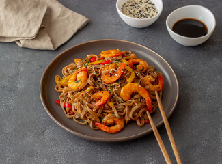 Noodles with shrimps, pepper and soy sauce. Asian food. Wok.