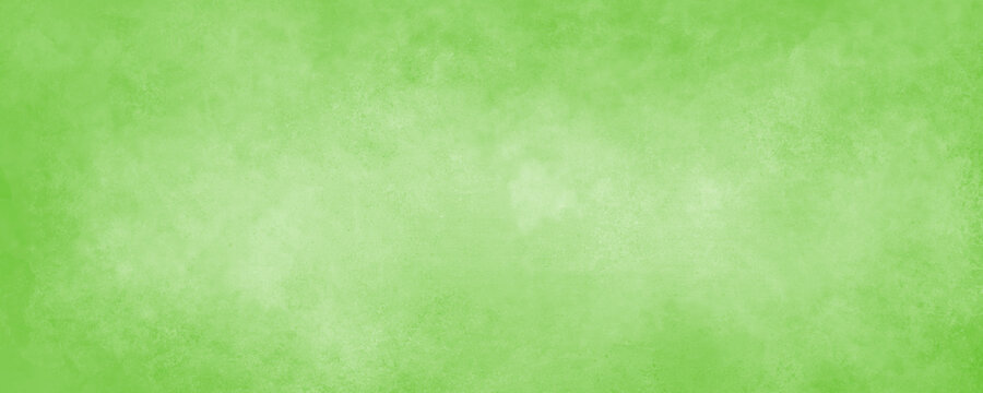 Light green background paper with soft grunge border texture for Christmas or st. Patrick's day designs, or Easter and spring colors