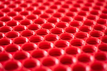 recycling plastic concept. red abstract background of plastic caps from a bottle, top view, short focus