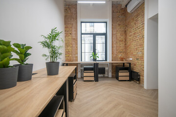 Picture of a part of modern office with wooden furniture