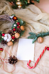 Fototapeta na wymiar Cute Christmas flat lay with ginger bread man and bokeh lights on wood. Mockup gift card