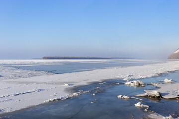 Fototapeta na wymiar Winter frozen River Volga near Samara. Winter landscape on the bank of river. Russian winter. Soft focus