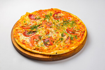 Pepperoni pizza on a white background. Traditional Italian pizza with tomatoes and meat isolated on white.