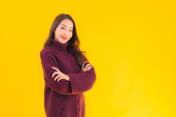 Obraz premium Portrait beautiful young asian woman smile on yellow isolated background