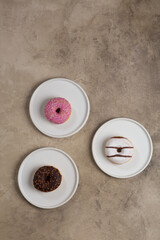colorful donuts on rustic textured background