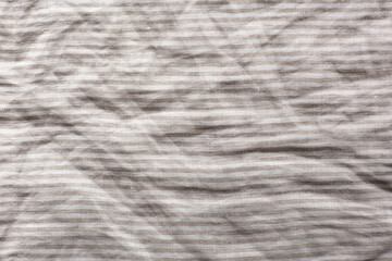 Fototapeta na wymiar Crumpled beige linen fabric