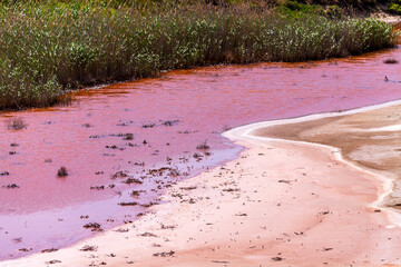 The water in the river is red due to iron saturation