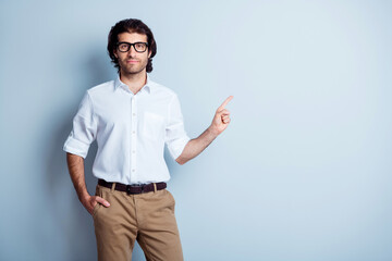 Fototapeta premium Photo portrait of confident man pointing finger at blank space isolated on clear white colored background