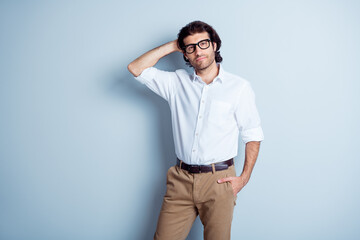 Fototapeta premium Photo portrait of handsome man touching his hair isolated on clear white colored background