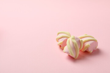 Sweet marshmallow on pink background, space for text