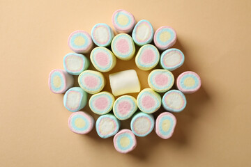 Sweet marshmallow on beige background, top view