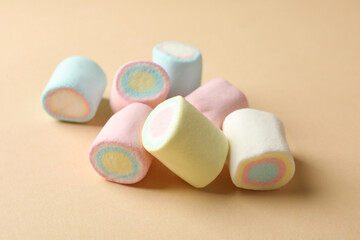 Sweet marshmallow on beige background, close up