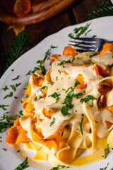 Tagliatelle with fresh chanterelles in a mushroom sauce