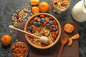 Concept of tasty breakfast with granola on black smokey background
