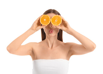 Funny young woman with orange slices on white background