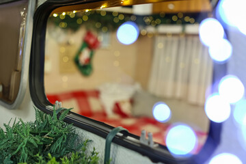 Window of motorhome decorated for Christmas