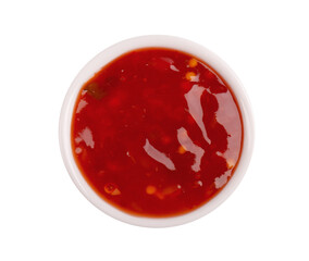 Sweet chili pepper sauce in bowl, isolated on white background. Spicy tomato and chili pepper sauce. Top view.