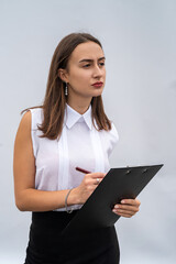 Fototapeta premium cheerful business woman with clipboard, isolated on white background