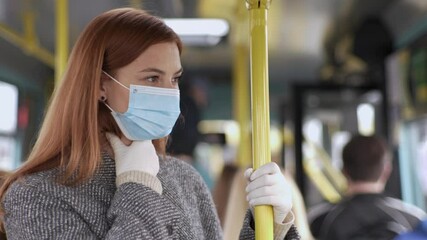 pandemic, young woman wearing a medical mask and seals is not feeling well from headaches and sore throat while traveling by bus, virus and infection - Powered by Adobe
