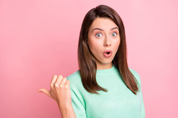 Photo of shocked young lady indicate thumb empty space open mouth wear turquoise sweater isolated pink color background