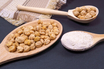 Chickpea flour on a rustic background close-up. selective focus