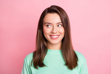 Fototapeta premium Photo portrait of curious brunette girl smiling looking at blank space think about idea isolated on pastel pink color background