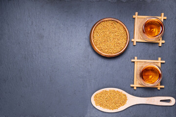 Fenugreek Seeds or MethiDana drink by speaking it in water overnight. close up. flat lay. copyspace