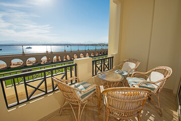 Terrace balcony with chairs in tropical luxury apartment resort