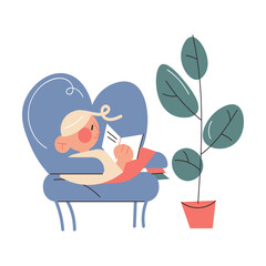 Smiling little blonde girl relaxing in armchair at home and enjoying reading book