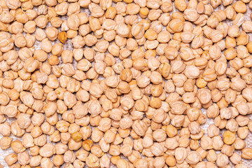Uncooked dried chickpeas. Heap of legume chickpea. background texture