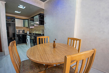 Interior design of luxury apartment dining room and kitchen