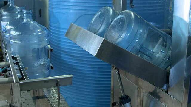 Plant conveyor with reusable water cooler bottles