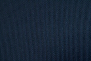 Textured background made of dark wool fabric. Horizontal orientation