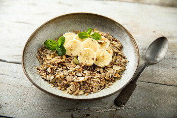 Traditional homemade granola with fresh banana
