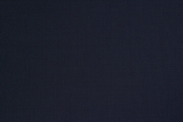 Background made of natural dark purple fabric for autumn and winter wardrobe. Horizontal orientation