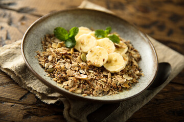 Traditional homemade granola with fresh banana