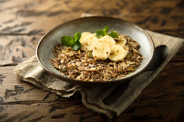 Traditional homemade granola with fresh banana