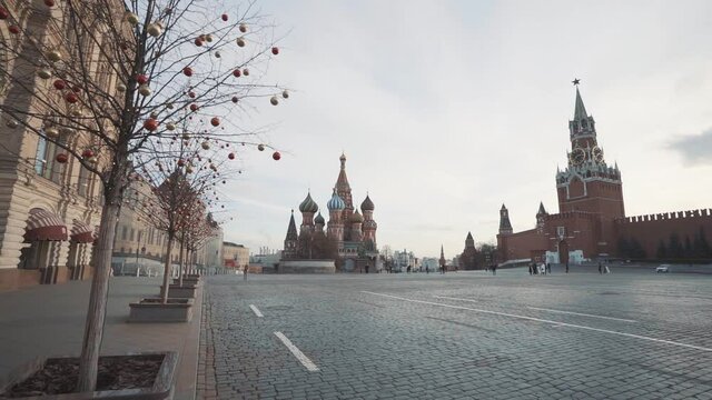 camera movement along trees decorated with Christmas balloons on red square in Moscow in winter