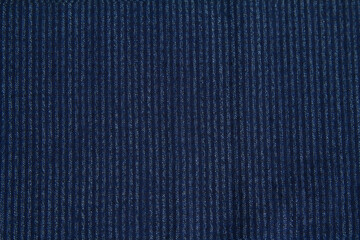 Background of textured wool fabric in a small blue stripe for autumn and winter wardrobe. Horizontal orientation