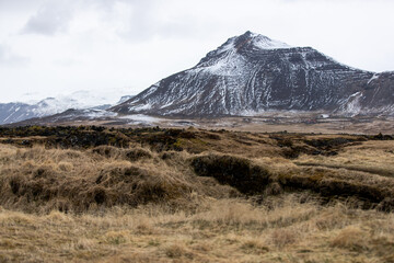 A landscape of a snowy mountain in Iceland in spring