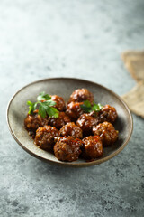 Homemade spicy meatballs with fresh parsley