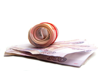 Banknotes, bills, coins of Russia, rolled up in a tube , isolated on a white background, panoramic...