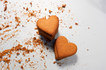 Homemade heart shaped cookies on bright background
