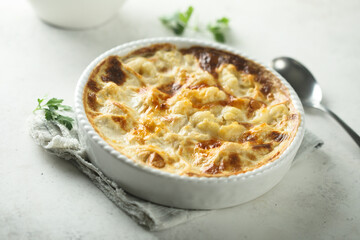 Homemade cauliflower gnocchi casserole with cheese