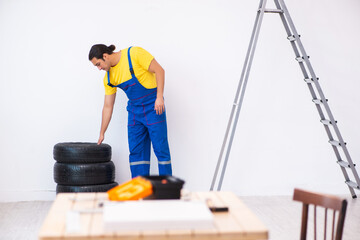 Young male carpenter working indoors