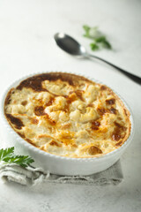 Homemade cauliflower gnocchi casserole with cheese