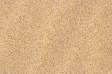 Fototapeta na wymiar Fine sand, yellow sand background on the beach.