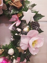 christmas wreath with pink flowers. New year decoration