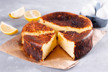 San Sebastian cheesecake cut and sliced for serving on a background